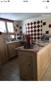 a kitchen with a sink and a counter top at Charmant T2 proches centre village in Les Rousses