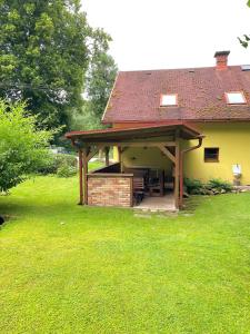 a house with a pavilion in a grassy yard at Jedlinka 37 in Klášterec nad Orlicí