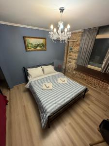 A bed or beds in a room at Ionia rooms