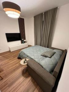 a bedroom with a bed and a couch in it at Soleo guesthouse in Monza