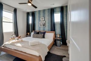 a bedroom with a large bed and windows at Nashville - 5627 Lenox Ave in Nashville