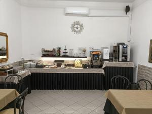 Kuchyň nebo kuchyňský kout v ubytování Hotel Cilene
