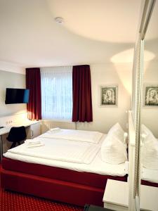 Ένα ή περισσότερα κρεβάτια σε δωμάτιο στο Hotel Brinckmansdorf