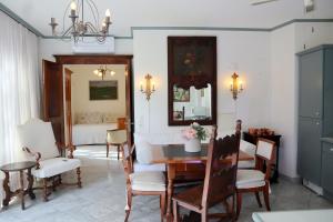 a dining room with a table and chairs at Barony romantic-residence in Lugano