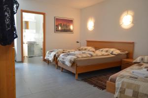 Cama o camas de una habitación en Don Camillo Gästehaus