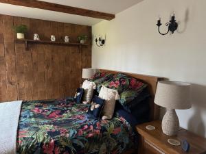 a bedroom with a bed with a colorful blanket at Fox Hill in Brompton