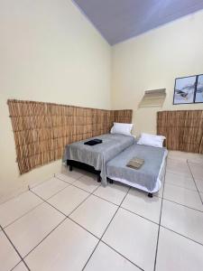 a bedroom with a bed in a room at Loft familiar Br-Aeroporto 2 in Uberlândia