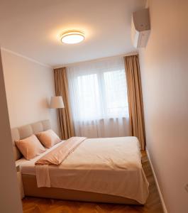 Ένα ή περισσότερα κρεβάτια σε δωμάτιο στο Apartament Gold 61