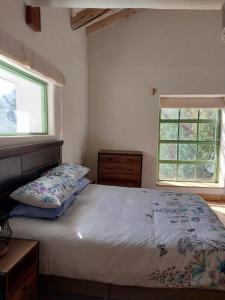 Ліжко або ліжка в номері COR Guesthouse at Sacred Valley Urubamba Cusco