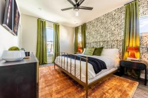 a bedroom with a bed and a ceiling fan at Nashville - 232 & 234 Oceola Ave - COMBO in Nashville