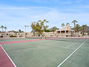 a tennis court in front of a house at Scottsdale - 6206 N 30th Pl in Phoenix