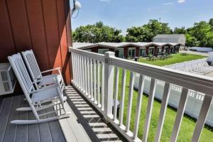 a pair of chairs sitting on a porch at Nader's Motel & Suites in Ludington