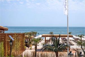 a view of a beach with the ocean in the background at Luxury by the Sea in Năvodari