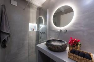 a bathroom with a sink and a mirror at Blue Paros House Paroikia Center close to port in Kampos Paros