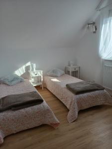 En eller flere senge i et værelse på Mały Domek Nadmorski