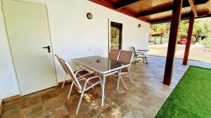 a table and chairs sitting on a patio at Spacious Country House in Arteara near Maspalomas in Artedara