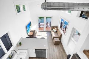 an overhead view of a living room with a television at Tiny Home on Waterfront, Bay Views, Deck, Pool in Jewfish