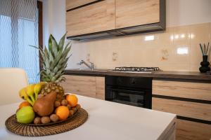 a bowl of fruit on a table in a kitchen at Luna al Monte in Cuasso Al Monte