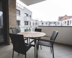 a table and chairs on top of a balcony at Jewish Quarter Hideaway with terrace and parking - 507 in Budapest