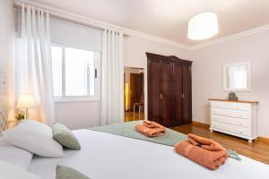 Łóżko lub łóżka w pokoju w obiekcie Apartamento Renovado "Hogar Las Vistas"