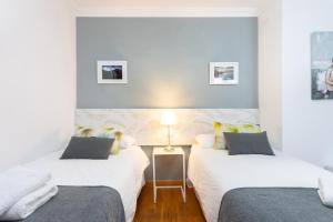 Łóżko lub łóżka w pokoju w obiekcie Apartamento Renovado "Hogar Las Vistas"