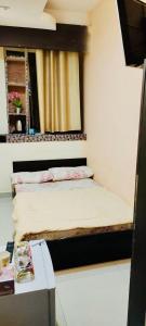 a small room with a bed and a table at AMAZING Couples private room close to Mall of Emirates in Dubai