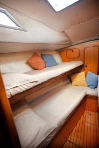a room with two bunk beds on a boat at XSail mediterraneo sport experience in Piombino