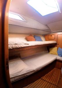 a room with two bunk beds on a boat at XSail mediterraneo sport experience in Piombino
