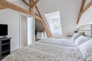 Ένα ή περισσότερα κρεβάτια σε δωμάτιο στο Maison avec Terrasse - 2 chambres confortables pour 4 à 6 personnes