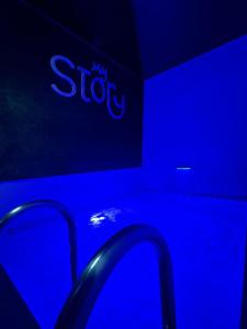 a blue room with a stop sign on the wall at Apartman My Story in Osijek