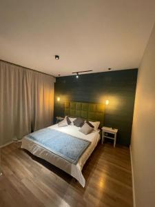 Cama ou camas em um quarto em Жк braun