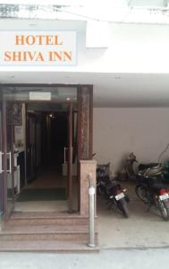 a hotel shivka inn with motorcycles parked outside of it at Goroomgo Shiva Palace Haridwar Near Railway Station - Excellent Customer Service - Best Seller in Haridwār