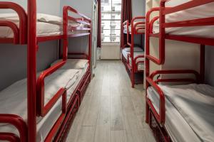 a group of bunk beds in a room at Astor Victoria Hostel in London