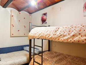 a bedroom with bunk beds and a climbing wall at Cortijo La Solana Montefrío in Montefrío +27 photos