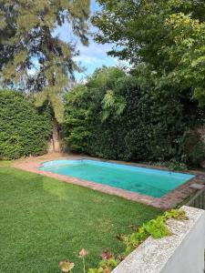 a swimming pool in the middle of a yard at Excellent apartment brand new in San Isidro