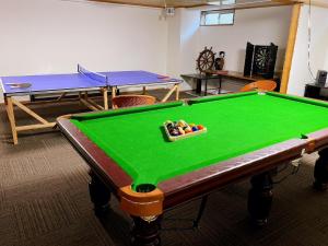 a room with a pool table and ping pong balls at Hakuba Sun Valley Hotel Annex - Vacation STAY 40560v in Hakuba