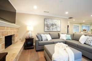 a living room with a couch and a fireplace at Destination #29 in Anaheim