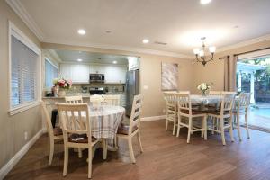a kitchen and dining room with a table and chairs at Destination #29 in Anaheim