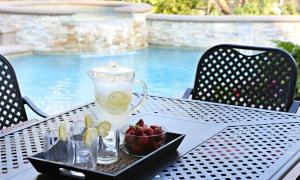 a tray of fruit and a pitcher of lemonade on a table at Destination #31 in Anaheim