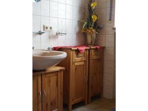 a bathroom with a sink and a counter with a sink at Lovely apartment in Kirn in Kirn