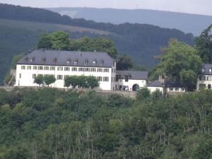 a large white building on top of a hill at Lovely apartment in Kirn in Kirn