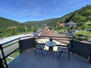 a balcony with two chairs and a table on a balcony at Apartment in Zwingenberg in Zwingenberg