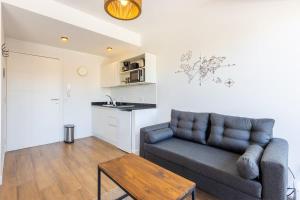 a living room with a couch and a table at Stay in Palermo in Buenos Aires