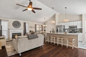 a living room with a couch and a kitchen at Time To Relax in Raleigh in Raleigh