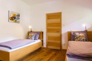 Postel nebo postele na pokoji v ubytování Julias Guesthouse + 26 fotografií