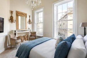 a bedroom with a bed and a large window at Former Prime Minister's Home in Bath