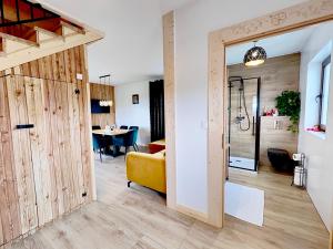 a room with a sliding door leading to a dining room at Nr1 Osada pod Giewontem in Czerwienne