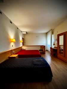 Postel nebo postele na pokoji v ubytování Hotel Ponte Molo