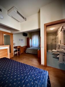 Postel nebo postele na pokoji v ubytování Hotel Ponte Molo