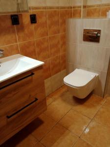 Ванная комната в Uroczy Apartament